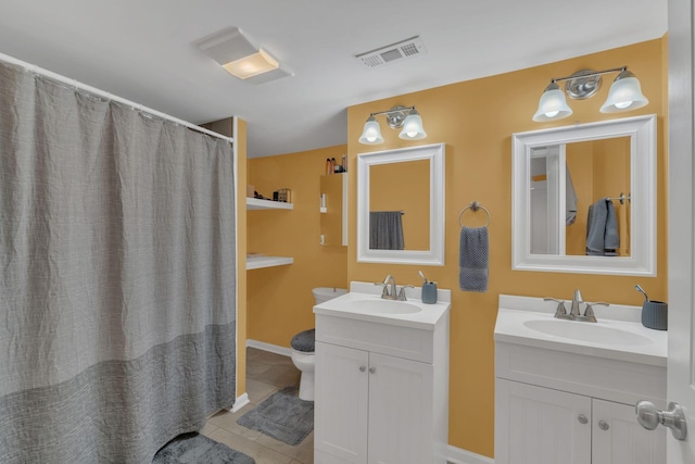 full bath with visible vents, two vanities, a sink, and tile patterned flooring