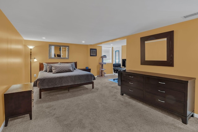 bedroom with recessed lighting, baseboards, visible vents, and light carpet