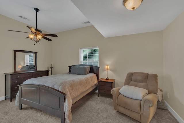bedroom featuring light colored carpet, baseboards, and visible vents