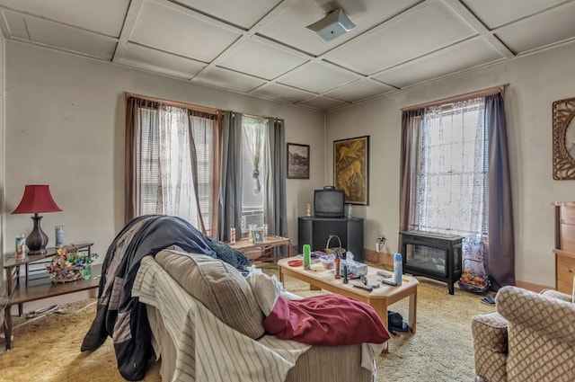 carpeted living room with coffered ceiling