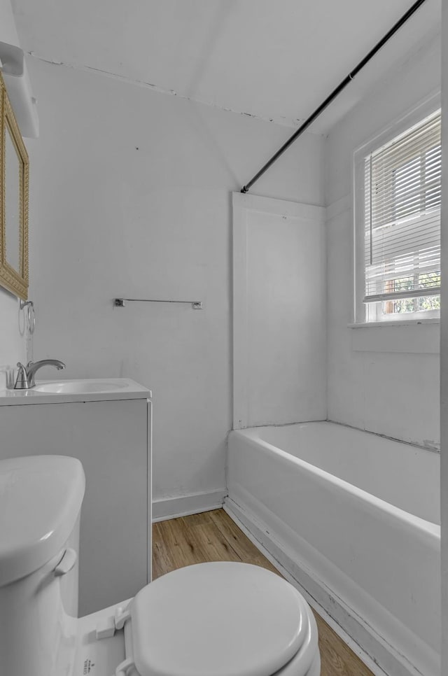 full bathroom with vanity, shower / tub combination, wood finished floors, and toilet