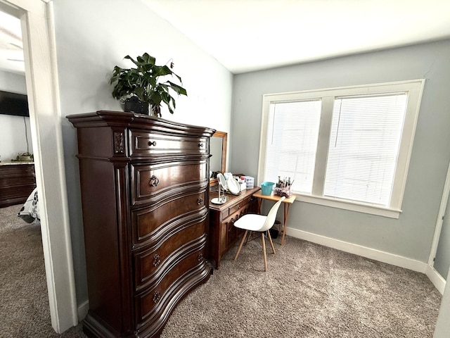 carpeted home office featuring baseboards