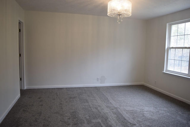 5170 Hickory Hollow Pkwy Unit 223, Antioch, TN 37013 - unfurnished room featuring carpet floors, baseboards, a chandelier, and a wealth of natural light