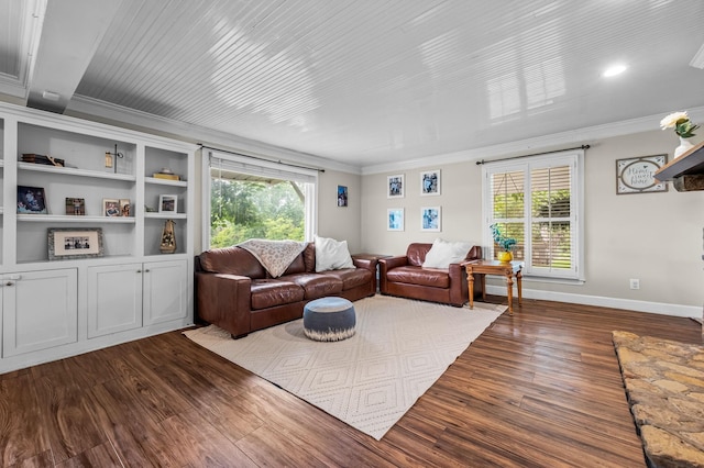 living area featuring crown molding, dark wood-style floors, healthy amount of natural light, and baseboards