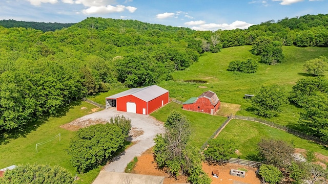view from above of property featuring a heavily wooded area