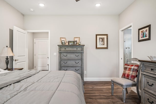 bedroom with baseboards, recessed lighting, and dark wood finished floors