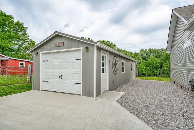 detached garage featuring driveway