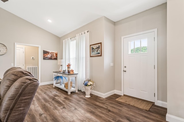 entrance foyer featuring visible vents, vaulted ceiling, baseboards, dark wood-style floors, and recessed lighting