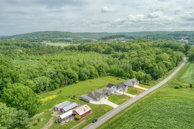 drone / aerial view featuring a view of trees
