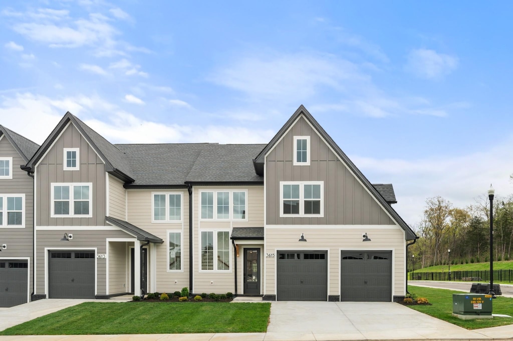 view of front of house featuring a garage, board and batten siding, and concrete driveway