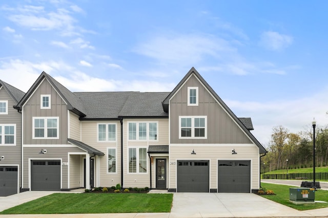 view of front of house featuring a garage, board and batten siding, and concrete driveway