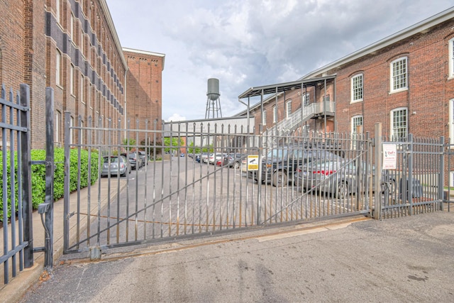 view of gate with fence
