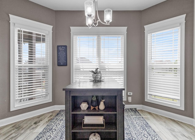 1132 Upland Ter, Clarksville, TN 37043 - interior space with baseboards, a chandelier, a wealth of natural light, and light wood-style flooring
