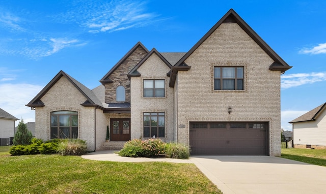 1132 Upland Ter, Clarksville, TN 37043 - view of front of house with a garage, driveway, a front lawn, and brick siding