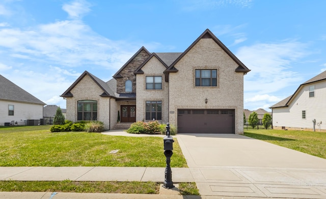 1132 Upland Ter, Clarksville, TN 37043 - view of front facade featuring brick siding, an attached garage, driveway, and a front yard