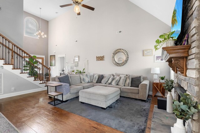 1132 Upland Ter, Clarksville, TN 37043 - living area with high vaulted ceiling, ceiling fan with notable chandelier, stairs, and wood finished floors