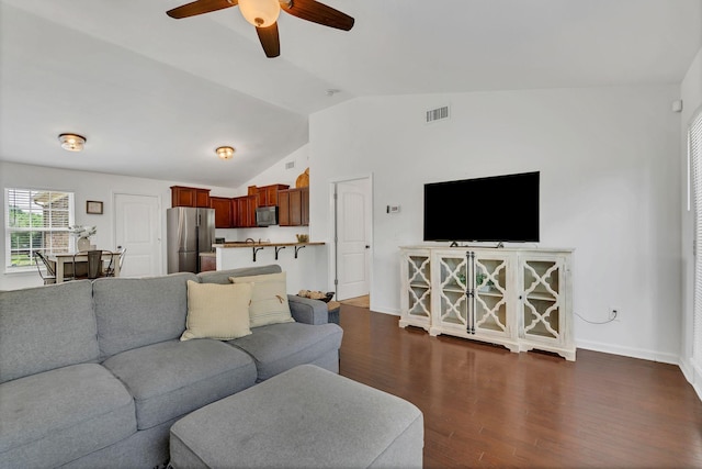 3005 Aruna Ct, Spring Hill, TN 37174 - living room featuring a ceiling fan, baseboards, dark wood-type flooring, and vaulted ceiling