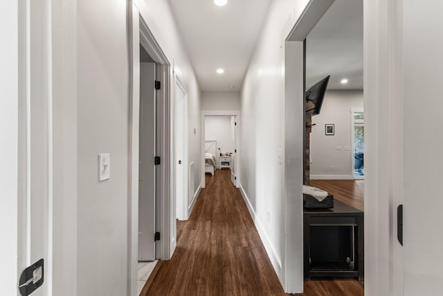 hall with recessed lighting, baseboards, and wood finished floors