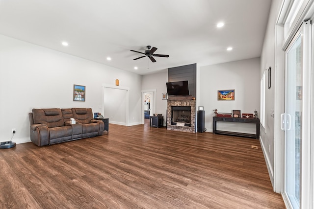 living area with recessed lighting, a ceiling fan, baseboards, and wood finished floors