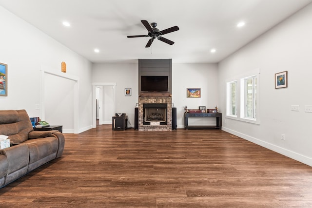 living area featuring recessed lighting, ceiling fan, wood finished floors, and a fireplace