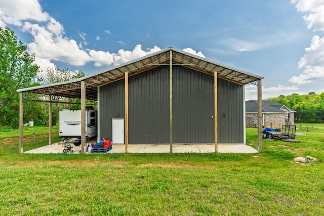 view of pole building with a yard