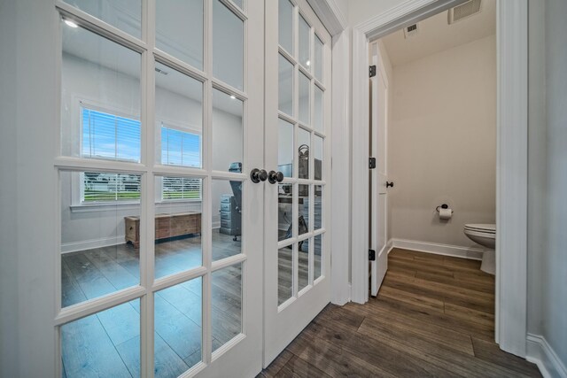 1055 Inez Dr, Smyrna, TN 37167 - bathroom with baseboards, wood finished floors, french doors, and toilet