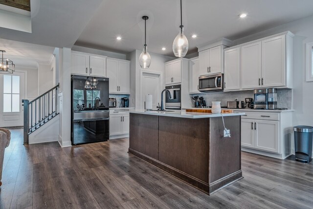1055 Inez Dr, Smyrna, TN 37167 - kitchen featuring stainless steel microwave, a chandelier, recessed lighting, dishwashing machine, and tasteful backsplash