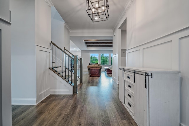 1055 Inez Dr, Smyrna, TN 37167 - entrance foyer with dark wood-style floors, a chandelier, ornamental molding, stairway, and a decorative wall