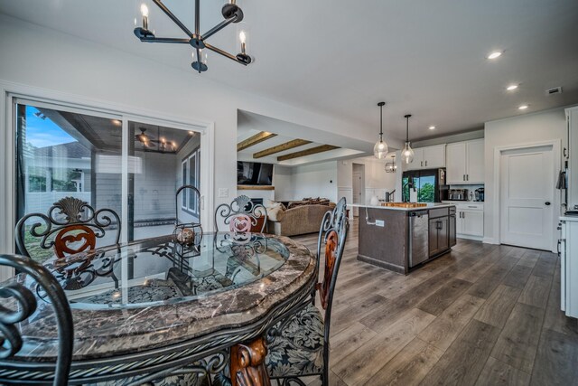 1055 Inez Dr, Smyrna, TN 37167 - dining space with dark wood finished floors, a chandelier, and recessed lighting