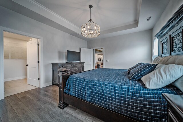 1055 Inez Dr, Smyrna, TN 37167 - bedroom with dark wood-type flooring, a chandelier, baseboards, crown molding, and a raised ceiling