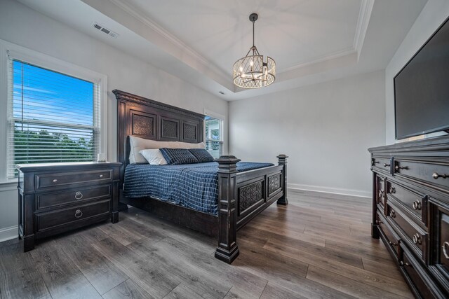 1055 Inez Dr, Smyrna, TN 37167 - bedroom with a raised ceiling, a chandelier, baseboards, dark wood finished floors, and crown molding