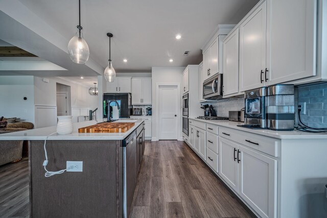 1055 Inez Dr, Smyrna, TN 37167 - kitchen featuring appliances with stainless steel finishes, a sink, light countertops, white cabinetry, and recessed lighting