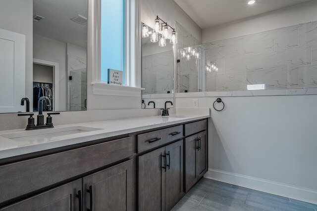 1055 Inez Dr, Smyrna, TN 37167 - full bath with a shower stall, double vanity, a spacious closet, and baseboards