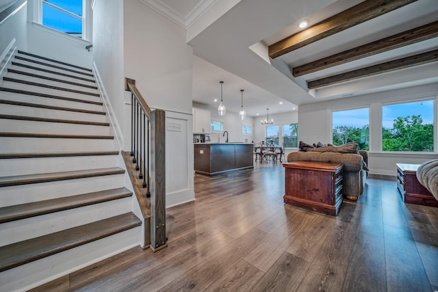1055 Inez Dr, Smyrna, TN 37167 - living area with stairway, dark wood-style floors, beam ceiling, recessed lighting, and a chandelier
