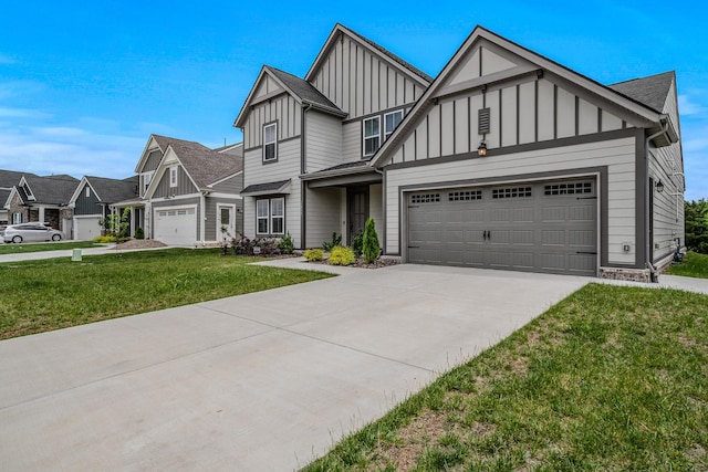 1055 Inez Dr, Smyrna, TN 37167 - view of front of house with board and batten siding, a garage, concrete driveway, and a front yard