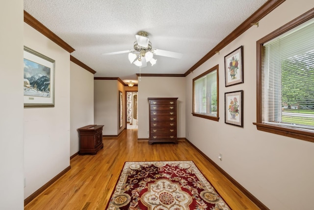 1314 Huntington Dr, Columbia, TN 38401 - hall with a textured ceiling, ornamental molding, baseboards, and light wood finished floors