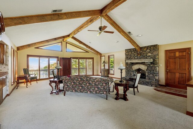 1314 Huntington Dr, Columbia, TN 38401 - carpeted living area featuring vaulted ceiling with beams, a fireplace, ceiling fan, and visible vents