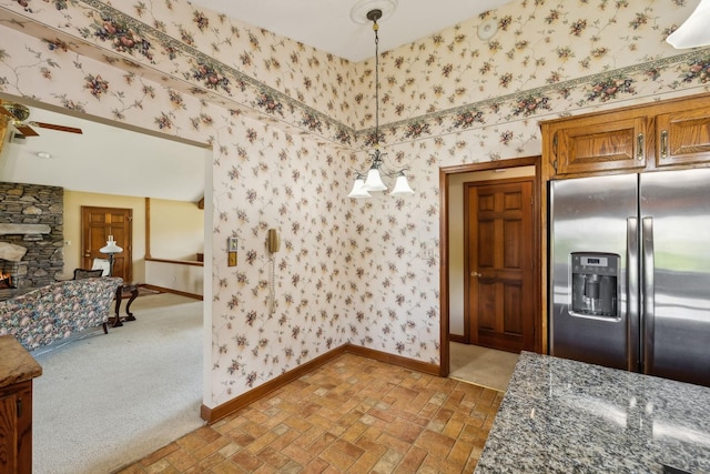 1314 Huntington Dr, Columbia, TN 38401 - interior space featuring stainless steel fridge with ice dispenser, baseboards, brick patterned floor, and wallpapered walls