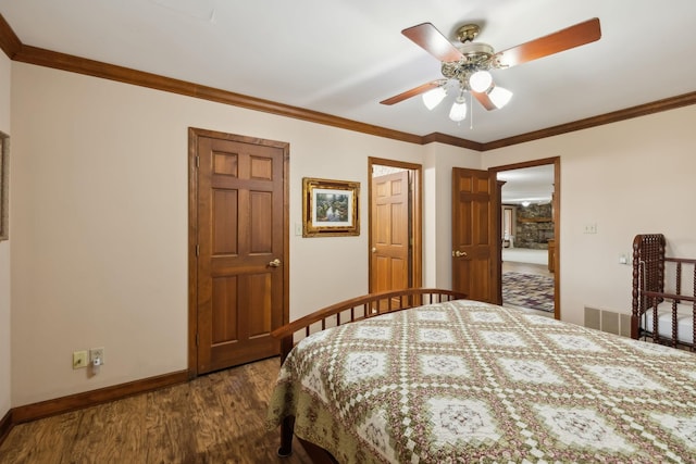 1314 Huntington Dr, Columbia, TN 38401 - bedroom featuring crown molding, dark wood-style flooring, baseboards, and visible vents