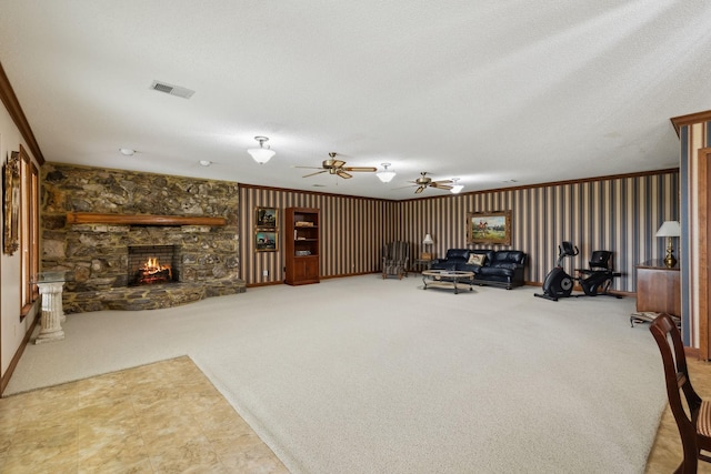 1314 Huntington Dr, Columbia, TN 38401 - living area featuring a ceiling fan, a textured ceiling, visible vents, a fireplace, and carpet flooring