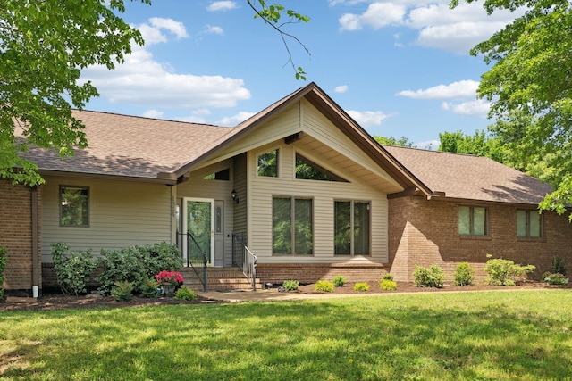 1314 Huntington Dr, Columbia, TN 38401 - view of front of house with brick siding, roof with shingles, and a front lawn