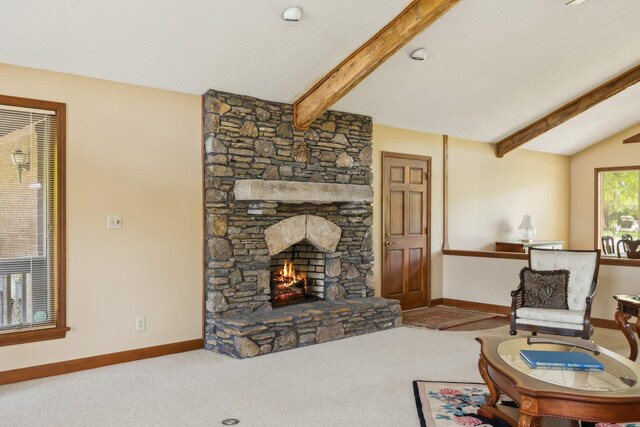 1314 Huntington Dr, Columbia, TN 38401 - carpeted living room featuring baseboards, lofted ceiling with beams, and a stone fireplace