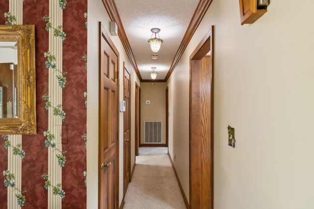 1314 Huntington Dr, Columbia, TN 38401 - hallway featuring crown molding, light colored carpet, a textured ceiling, baseboards, and visible vents