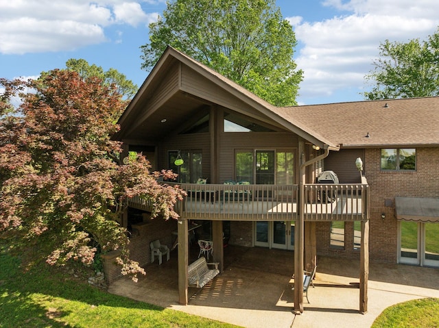 1314 Huntington Dr, Columbia, TN 38401 - back of property with brick siding, a shingled roof, a patio area, and a deck