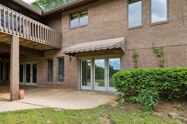 1314 Huntington Dr, Columbia, TN 38401 - back of property with brick siding, french doors, and a patio area