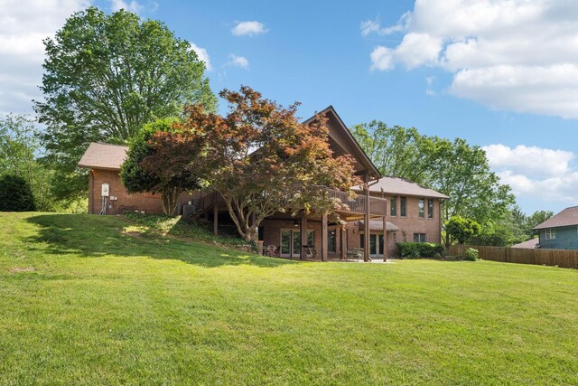 1314 Huntington Dr, Columbia, TN 38401 - rear view of property with brick siding, a yard, french doors, and fence