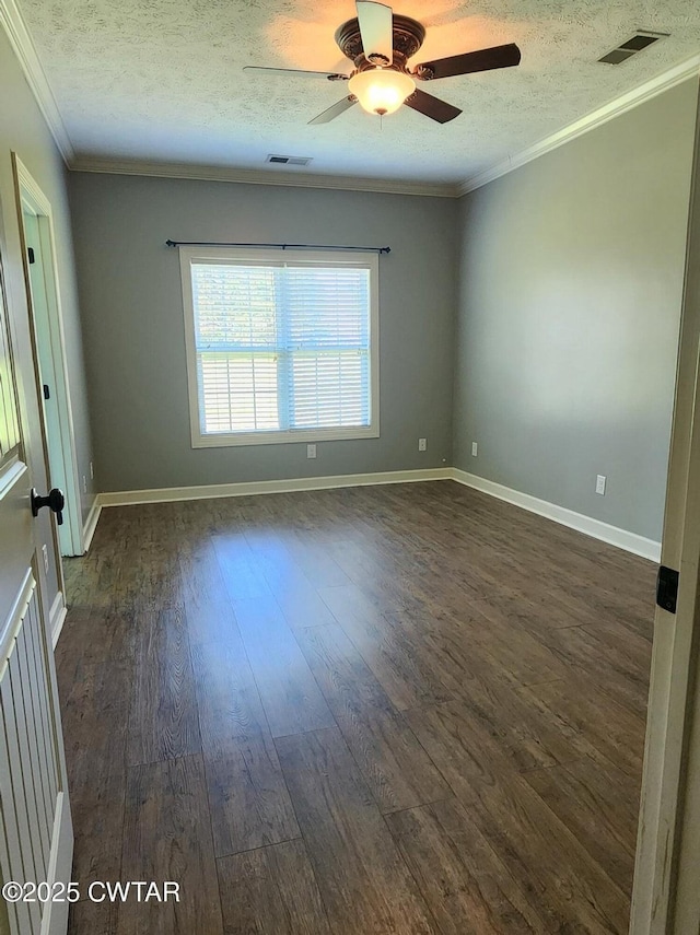 85 Neshova Ln, Henderson, TN 38340 - spare room with crown molding, a textured ceiling, visible vents, and dark wood finished floors