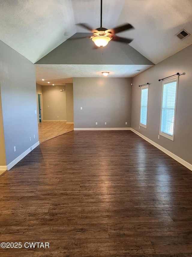 85 Neshova Ln, Henderson, TN 38340 - unfurnished room featuring baseboards, ceiling fan, vaulted ceiling, and wood finished floors