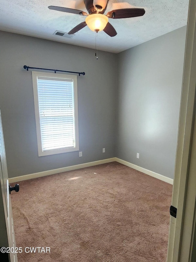 85 Neshova Ln, Henderson, TN 38340 - carpeted spare room with baseboards, a textured ceiling, ceiling fan, and visible vents