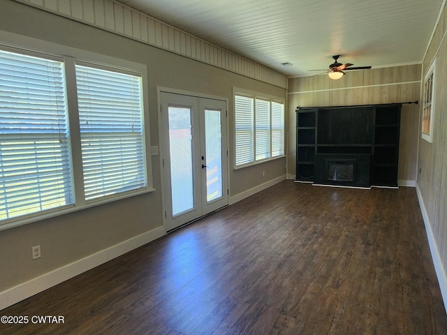 85 Neshova Ln, Henderson, TN 38340 - unfurnished living room featuring french doors, dark wood-style flooring, ceiling fan, and baseboards